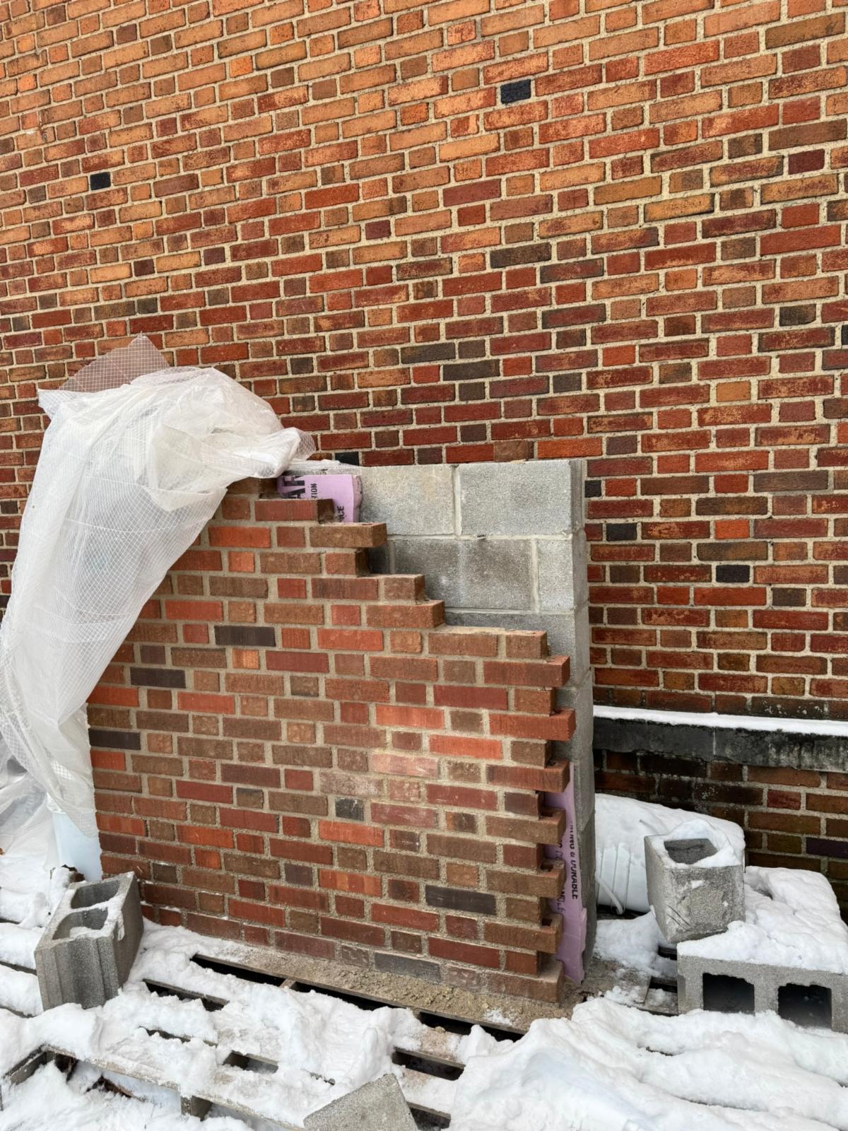 This brick panel shows the newly selected brick for the lobby addition to the Ludlow Early Learning Center. A small panel built with the new brick is shown here in comparison to the existing brick on the building.