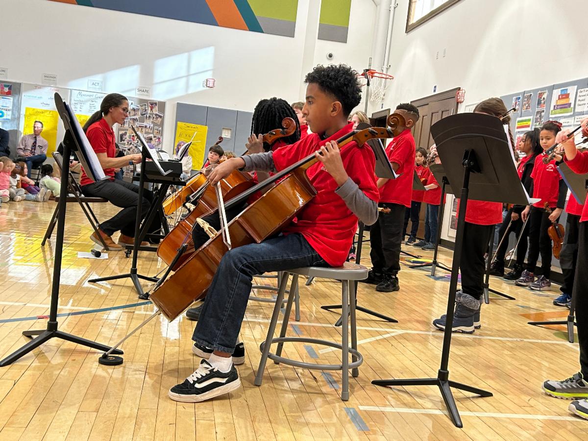 A Fernway student plays a cello during the El Sistema concert.