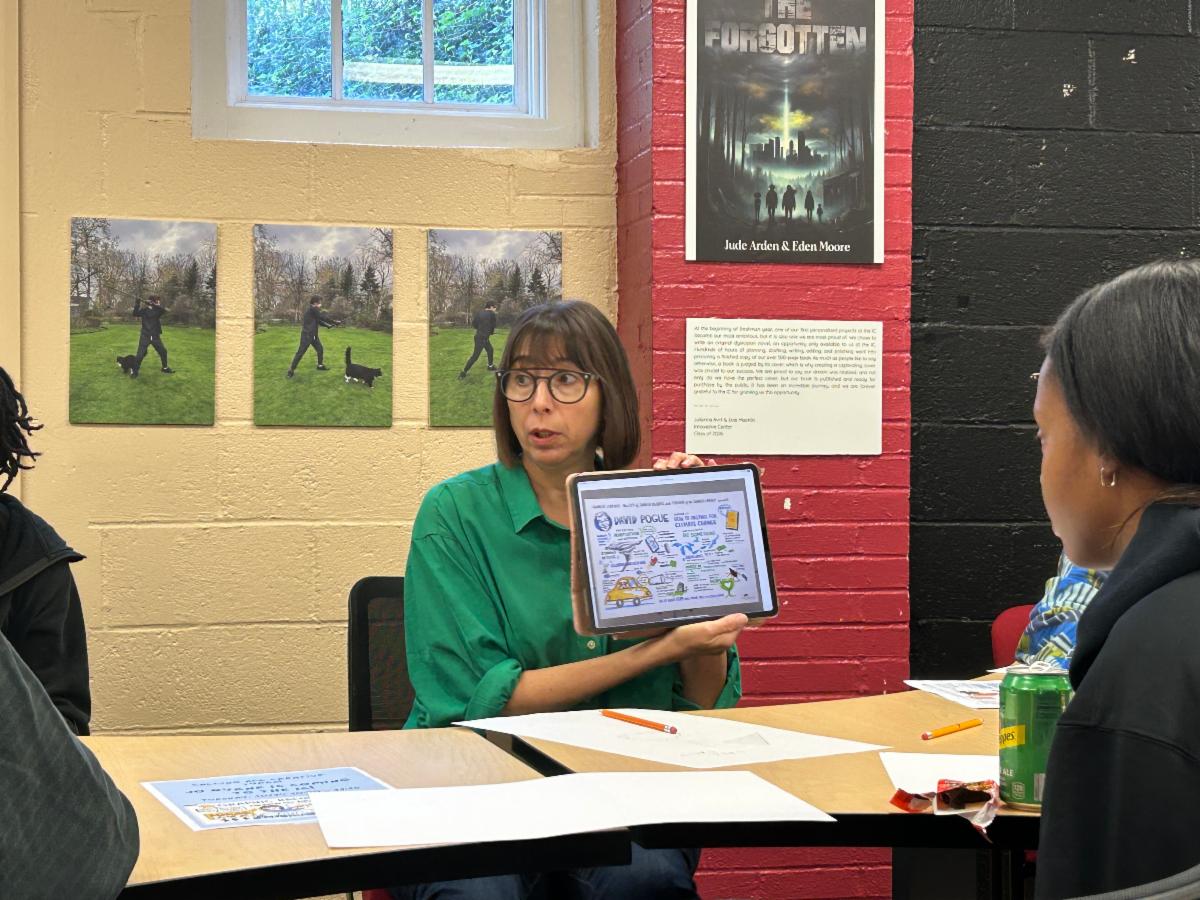 Jo Byrne a visual note taker shows some of her work on an iPad.