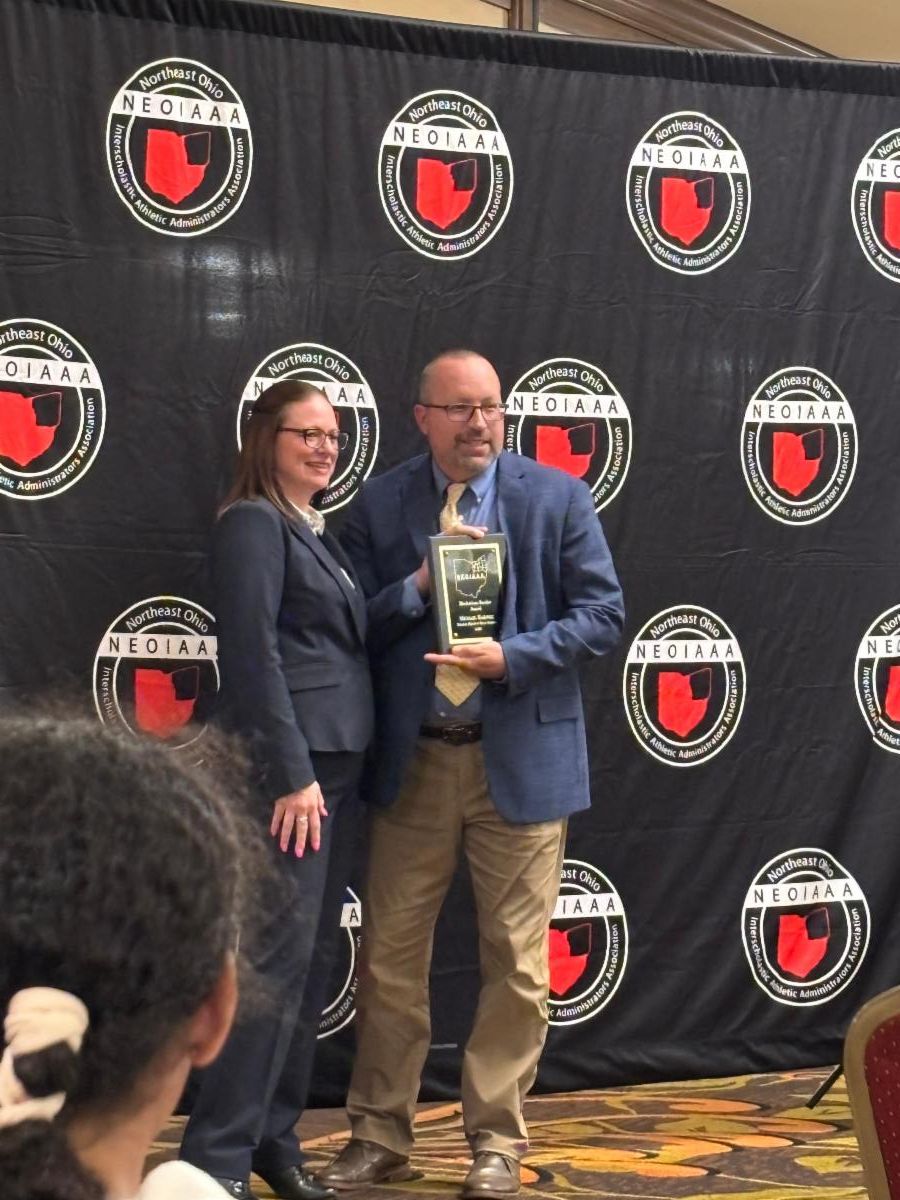SHHS Athletic Director Michael Babinec, right, accepts the award.