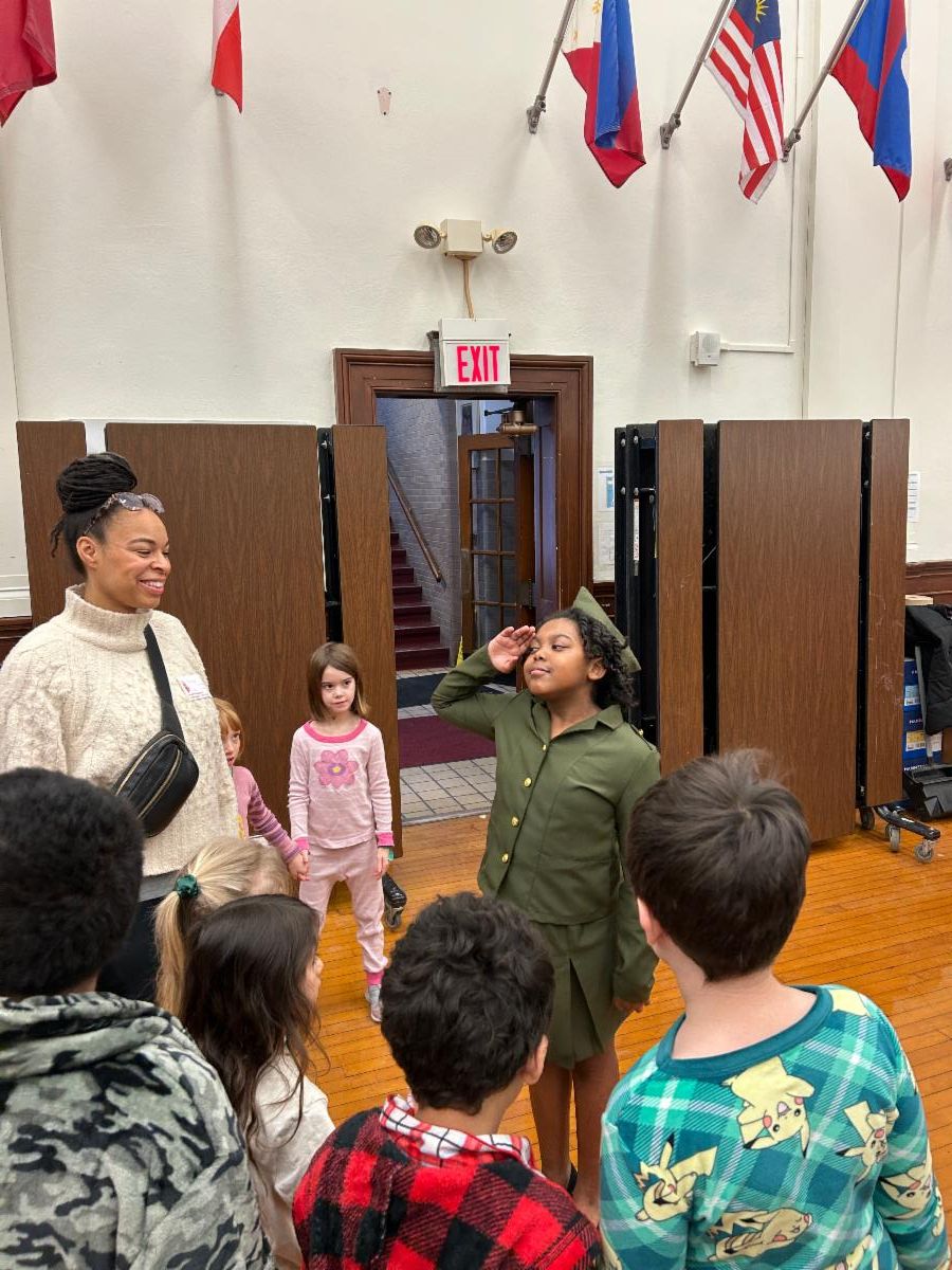 A student stands at attention while dressed as Charity Adams Earley at the Lomond Wax Museum.