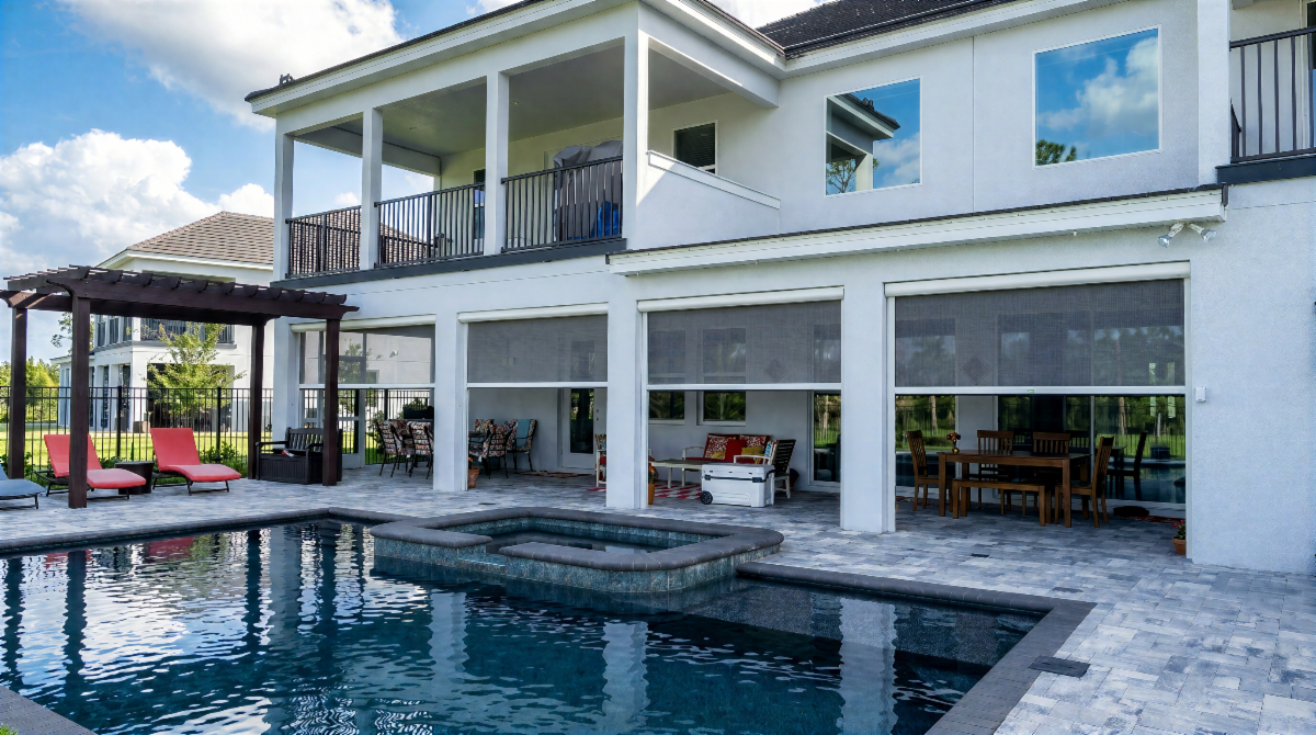 Mystic motorized screens installed across a luxury poolside outdoor living area