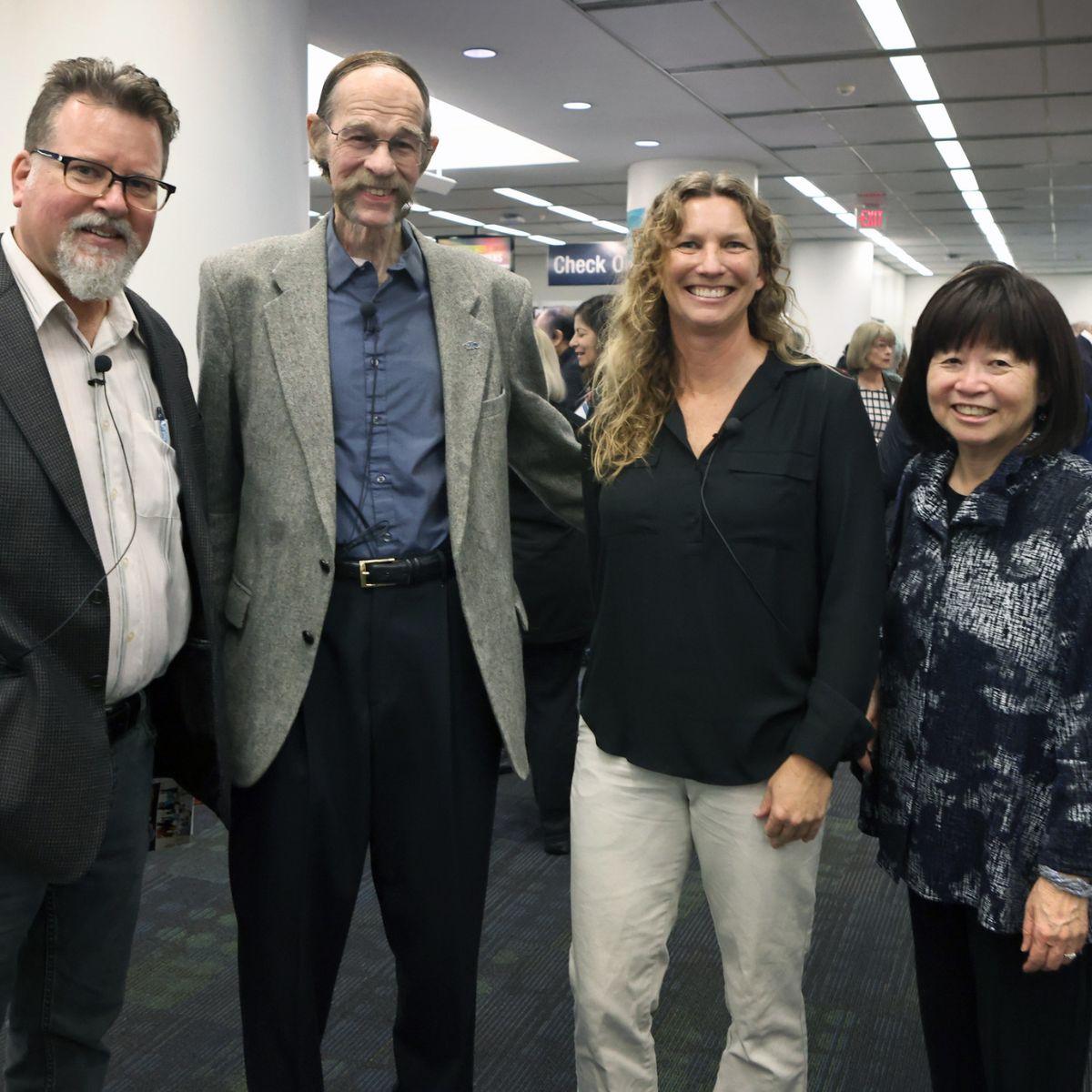 Anteater Experience exhibit opening panelists Steve Zylius and Jim Danziger and Megan Lulow smile with Endowed University Librarian Lorelei Tanji.
