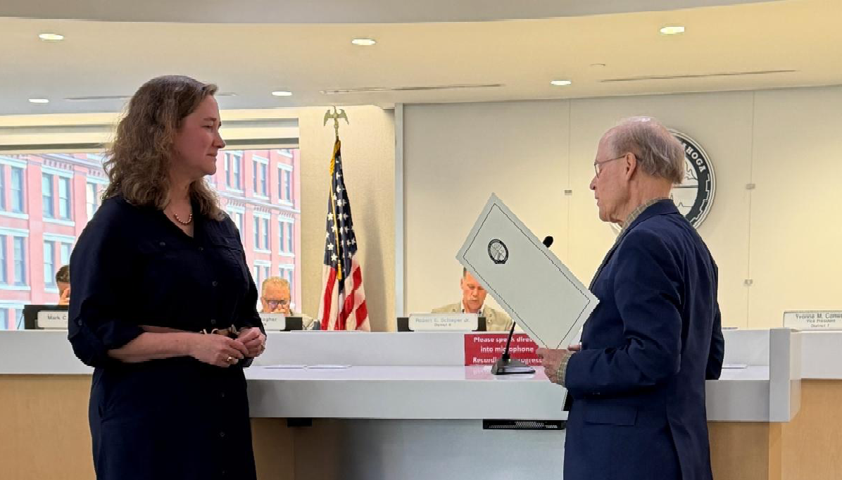 President Dale Miller presents Cuyahoga County Council’s proclamation for National Disability Employment Awareness Month to GCW’s Nancy Sidell.