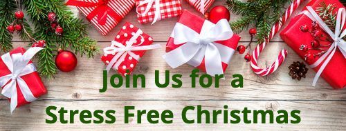 Christmas background with decorations and red gift boxes on wooden board with copy space