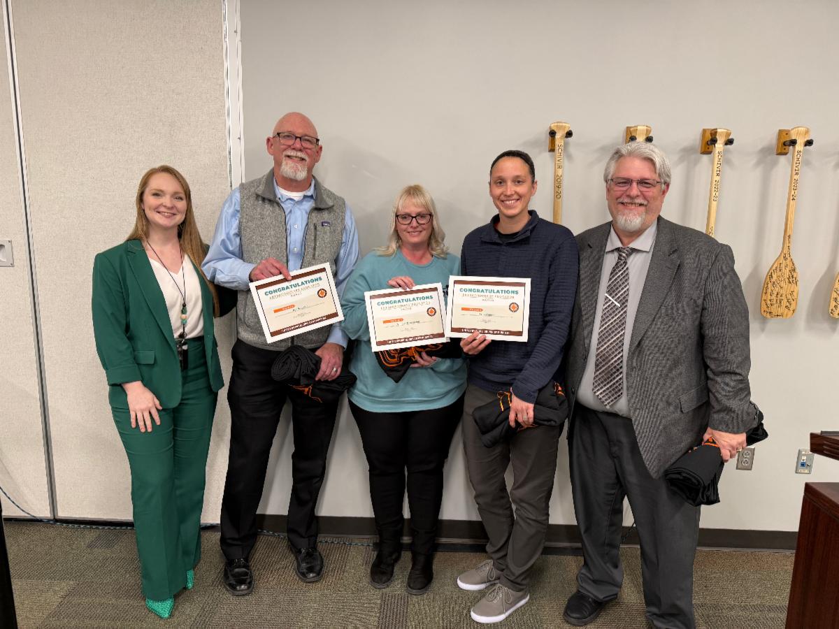 Members of the NCC Student Services Team posing for a photo with their Extraordinary Educator certificates