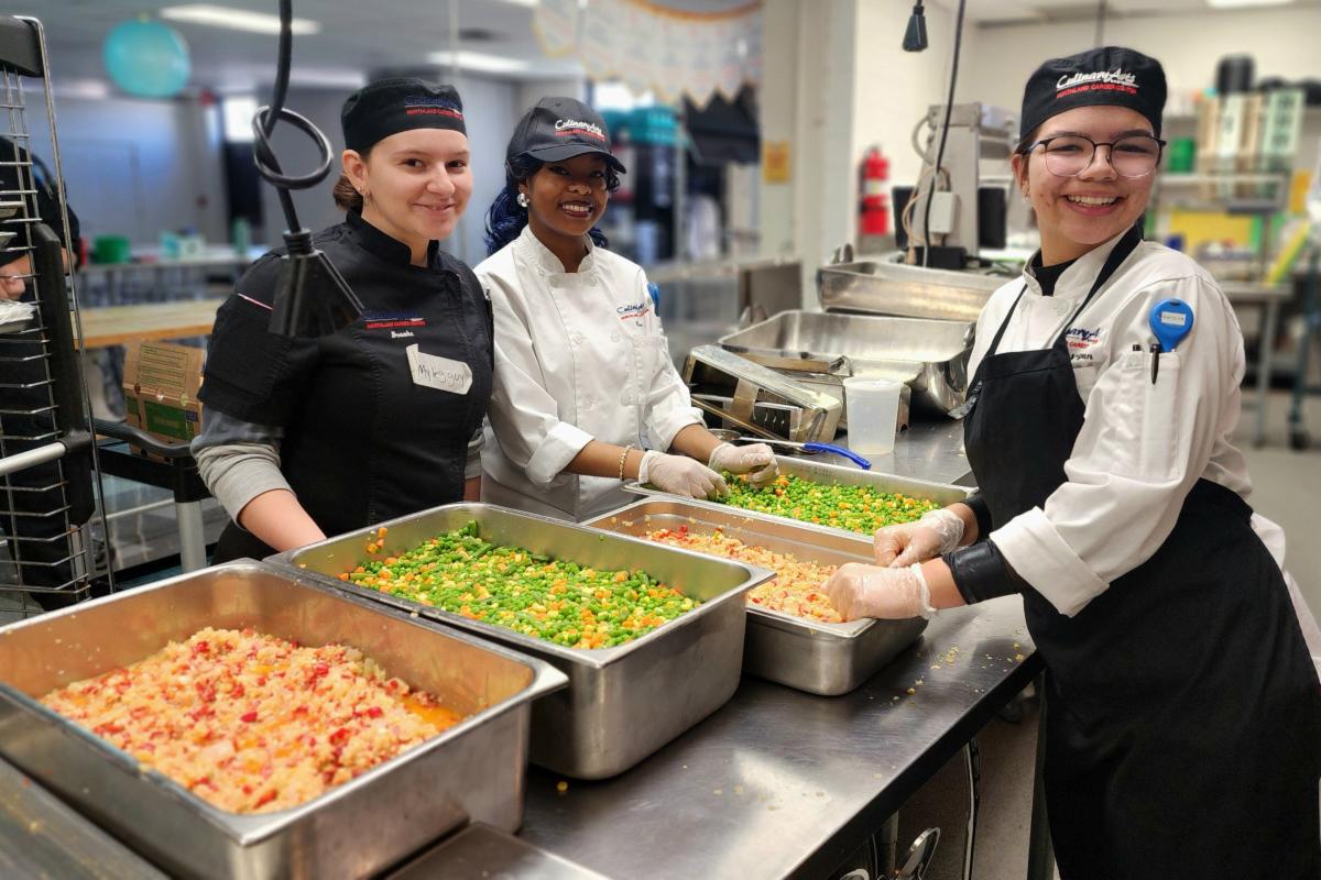 Northland Career Center Culinary Students prepare meal kits.