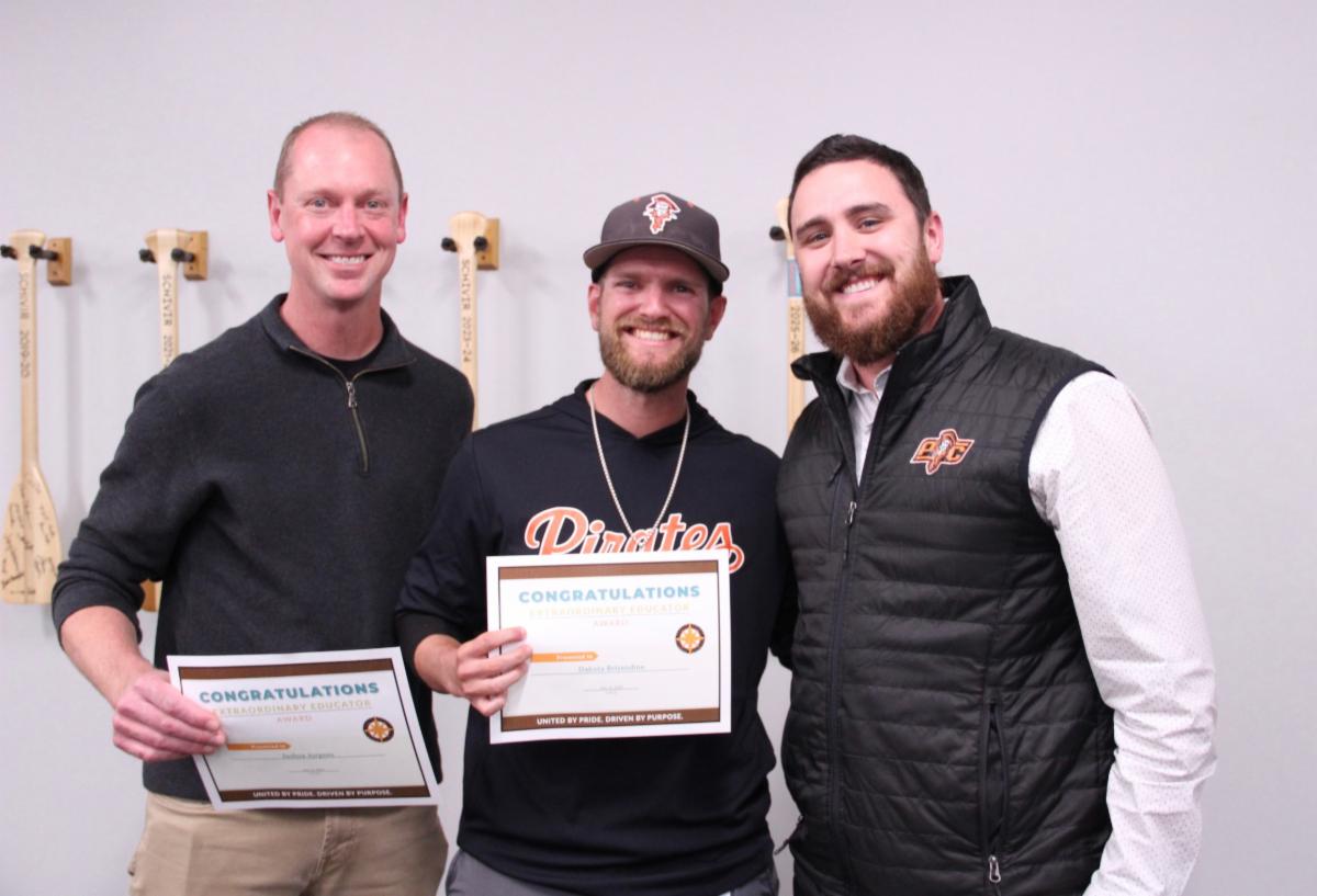 staff members pose for award
