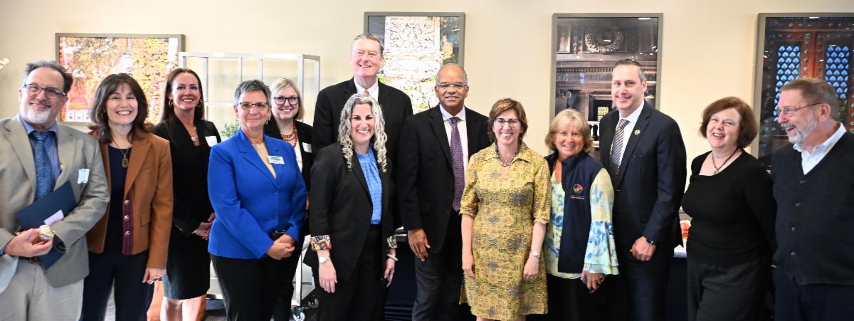 Municipal and state leaders stand with MAPC Executive Director Lizzi Weyant at MARPA 2025.