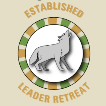 Wolf encircled with words ESTABLISHED LEADER RETREAT