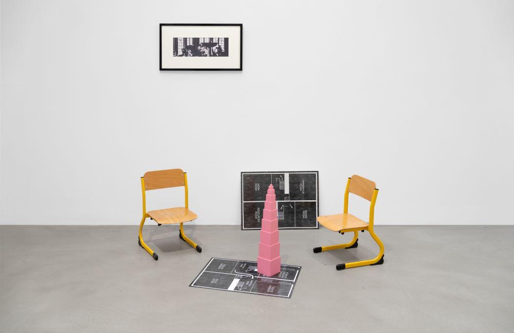 photo of chairs surrounding a pink tower of blocks