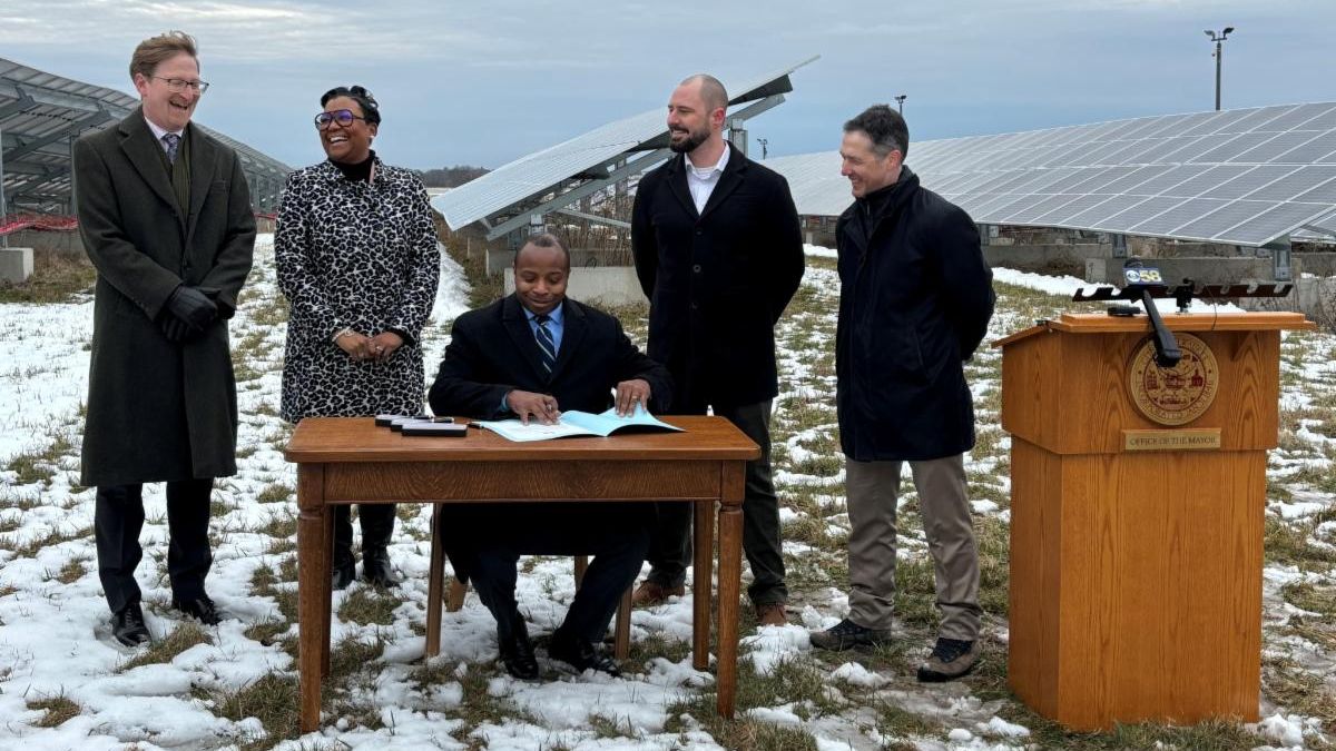 Mayor Johnson signing solar file