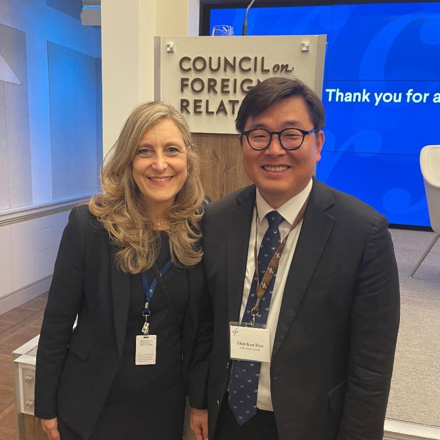 Ryu in formal wear next to a woman