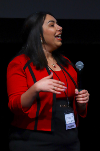 Najmeh speaking at a confrence