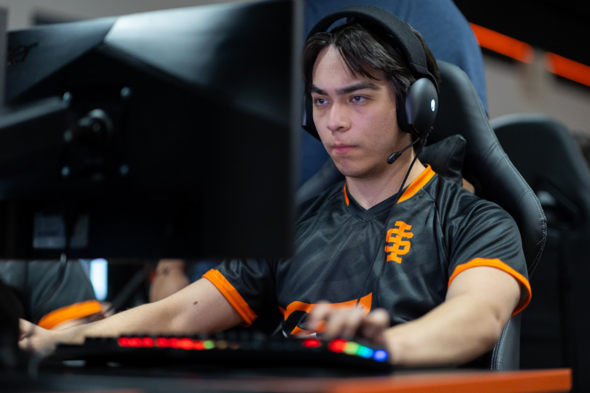 Cast of the musical perform onstage in costumes and dancing poses