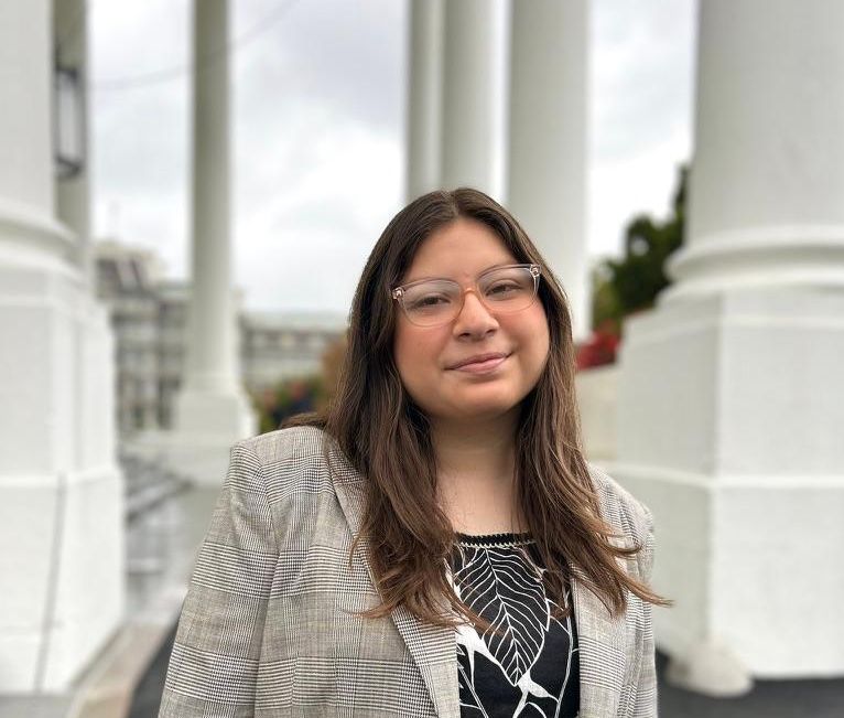 Headshot of Jennifer standing in front of the ISU pillars