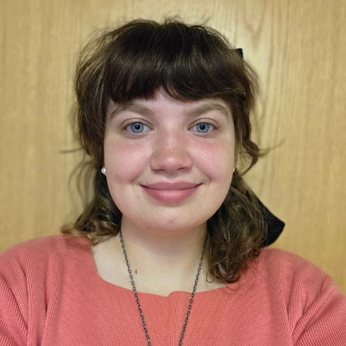 Hawkins holding a Roar flag