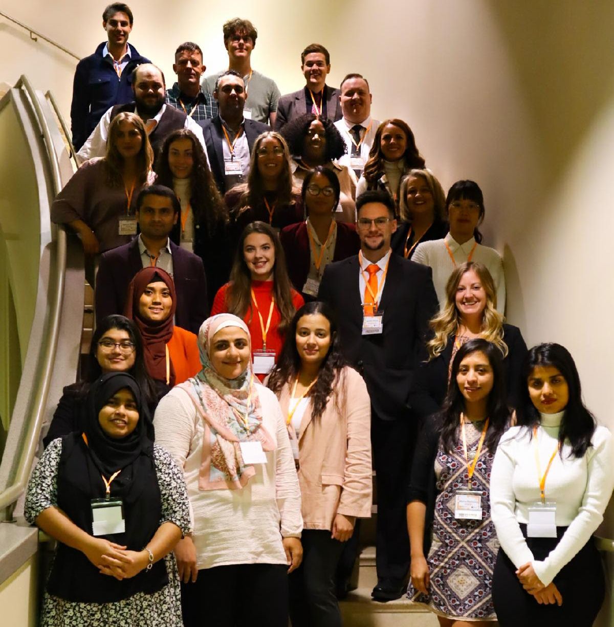 3MT competition participants standing on stairs