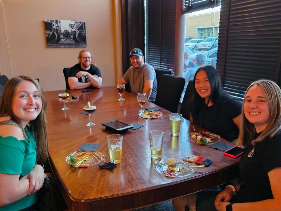 A group of people eating at a table