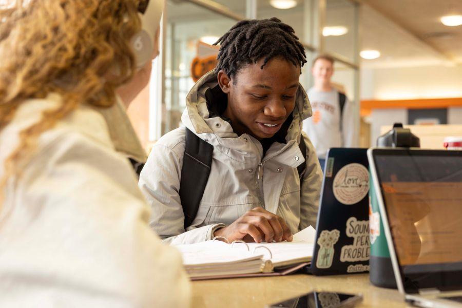 Two ISU students studying together