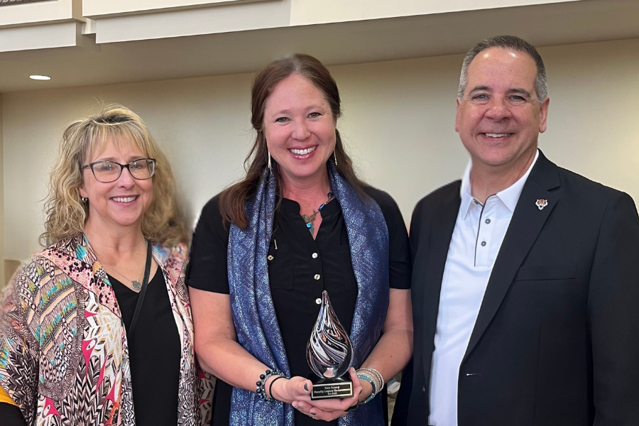 Group photo of Kandi, Tara, and President Wagner