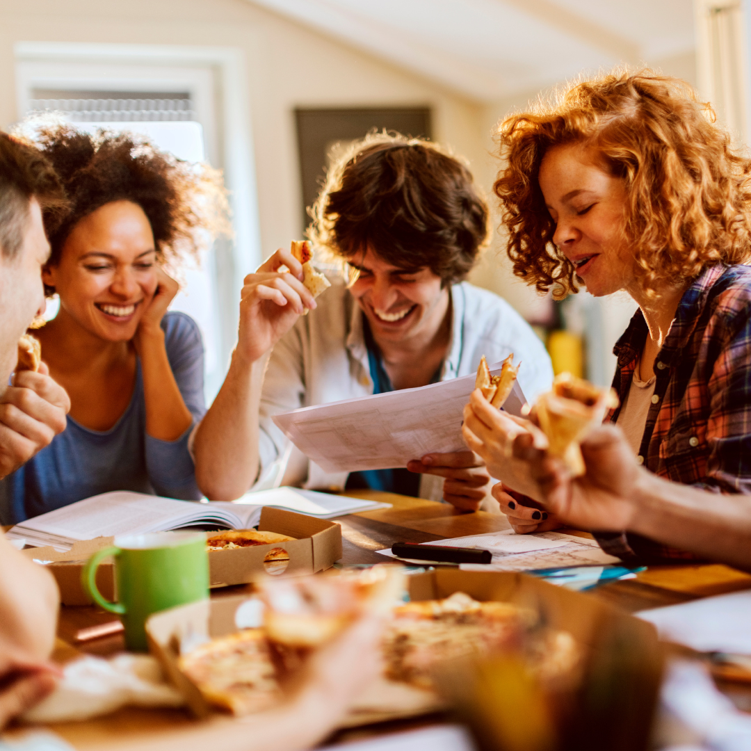 Students eating pizza and studying