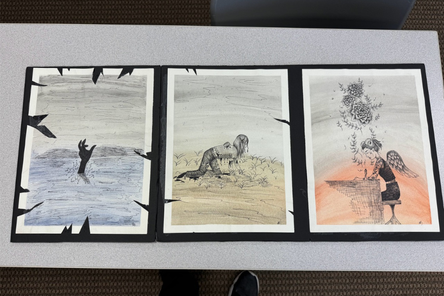 A piece of artwork (drawing) in three panels: The first panel shows a hand coming up out of water. The second shows a girl crawling on dirt as though just emerging from the water. A third shows a girl with wings, working at a desk.