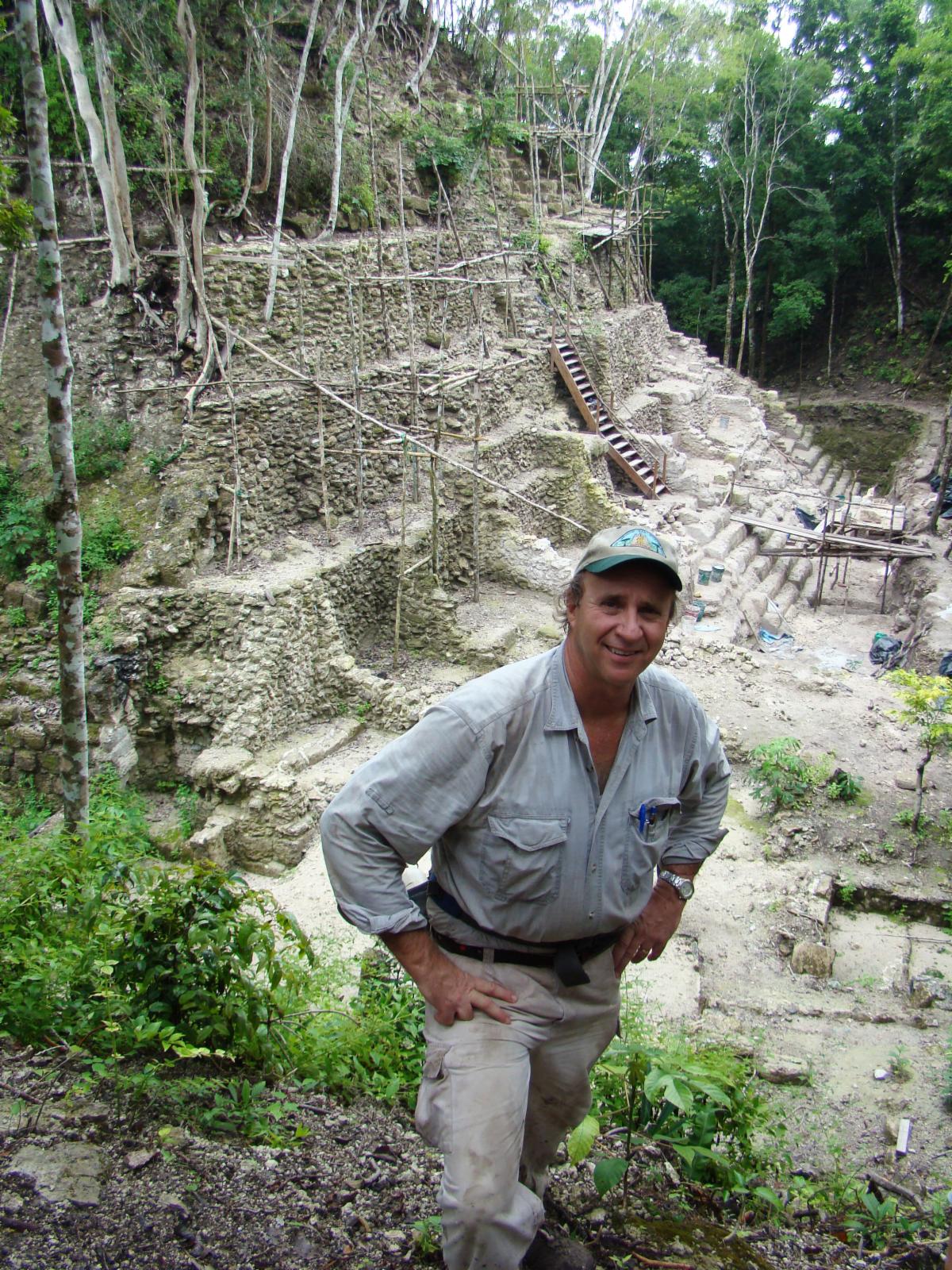 Richard Hansen in the field with archaelogical remains