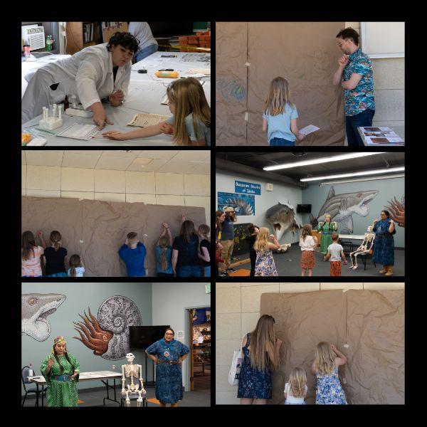 Community members draw on a large pinned up piece of paper, play a game with anthropology students, and work on labs with anthropology students in interactive hands-on activities at the Museum of Natural History at ISU