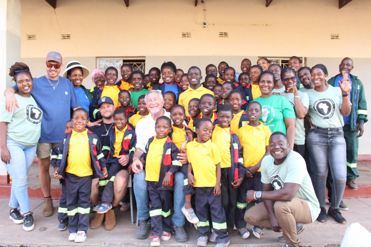 Big smiles from all as Jeff and Malawi Leadership take picture with CLI's Zimbabwe orphans 