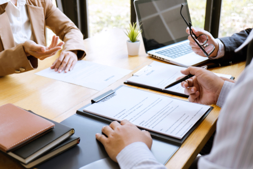 Business woman explaining about his profile to two selection committee manager sitting in during job Interview_ interview the job and hiring.