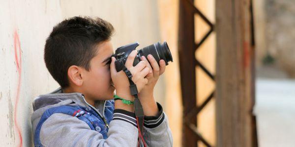 kid with a camera