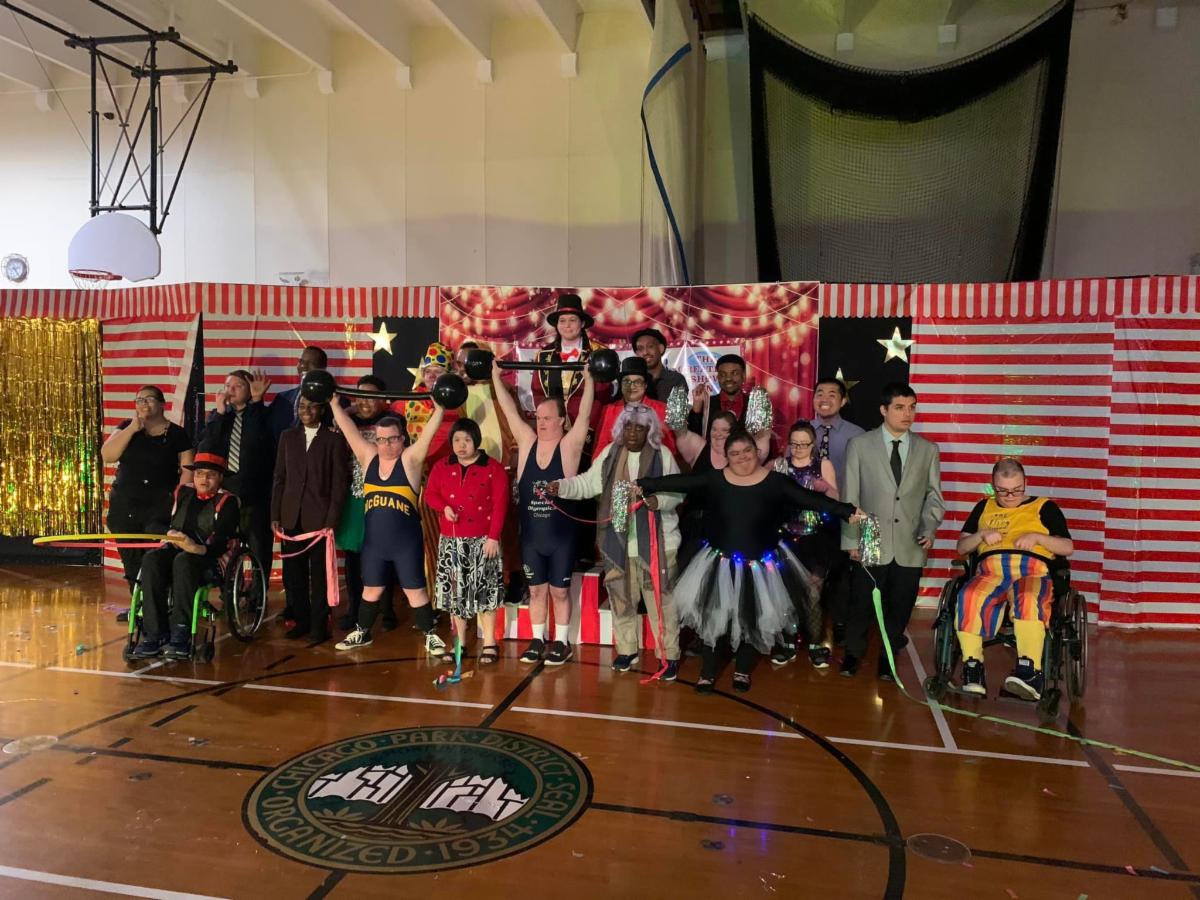 Pictured: McGuane Park Special Recreation Cast of "The Greatest Showman" standing in front of the performance stage.