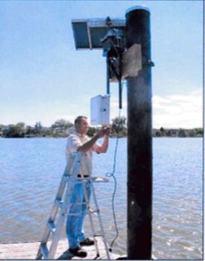 Staff performs maintenence on River Barge Park Water Quality Monitoring Station.