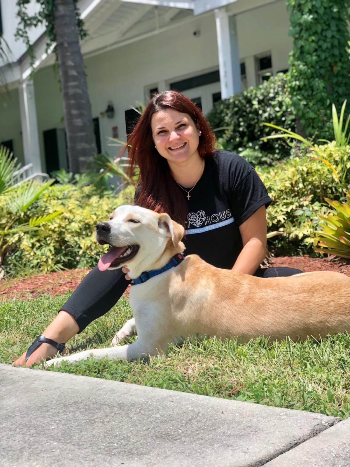 pedro and gina sitting outside in front of Kristi House