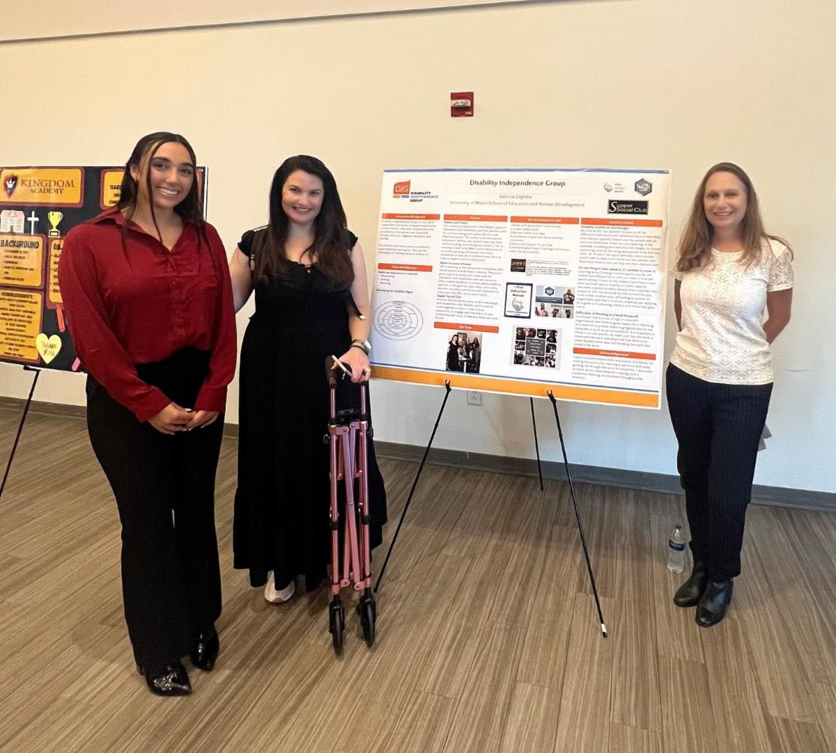 Sabrina Justine and Debbie in front of the DIG Board