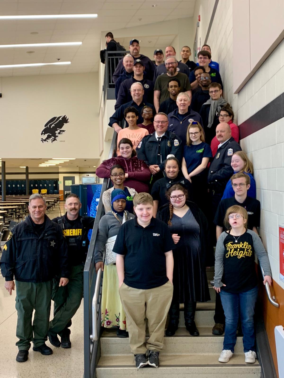 SWCSD Project Life Interns standing on a stairway with first responders police and teachers