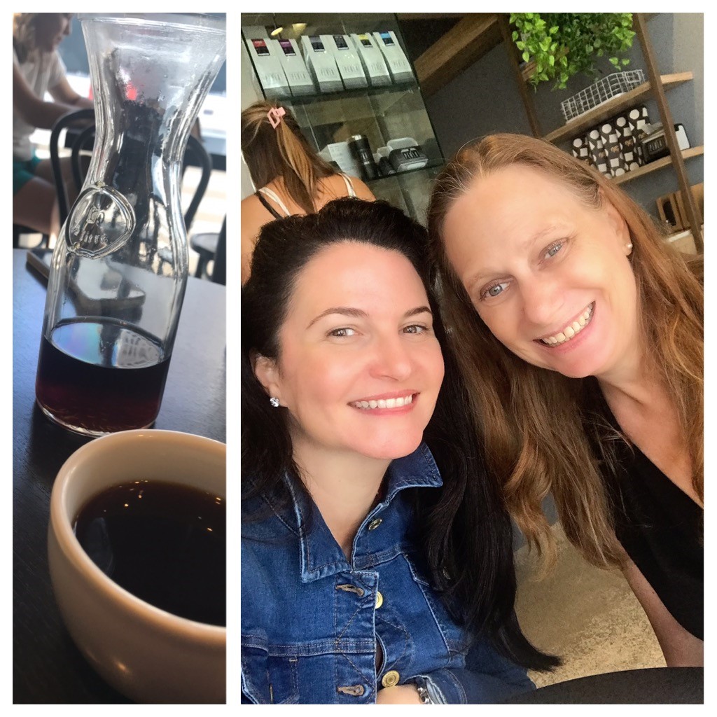 Photo of Justine and Debbie next to a cup of coffee