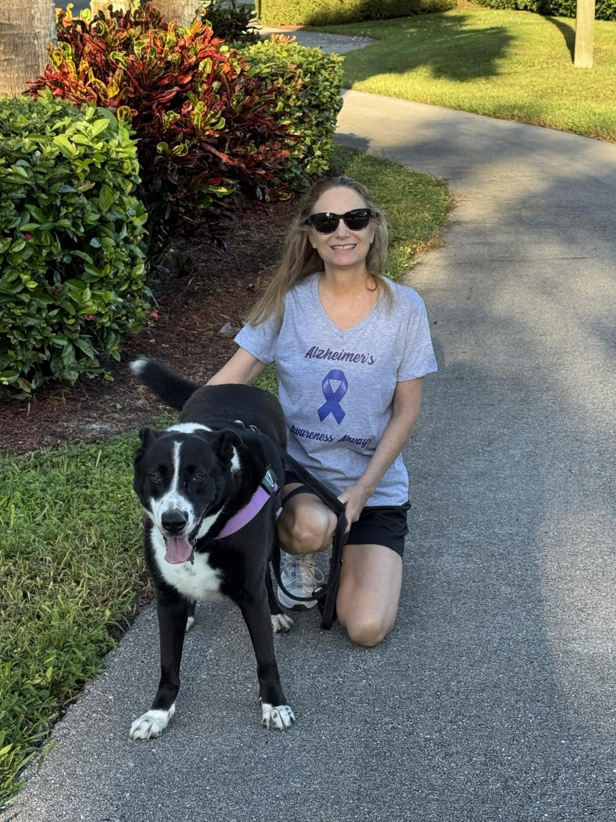 debbie and Lucy the dog and Debbie is wearing her t-shirt