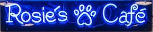 Image of the blue neon sign that says Rosie's Cafe with a paw print between the words and hangs outside the dining area at the Yorktown campus