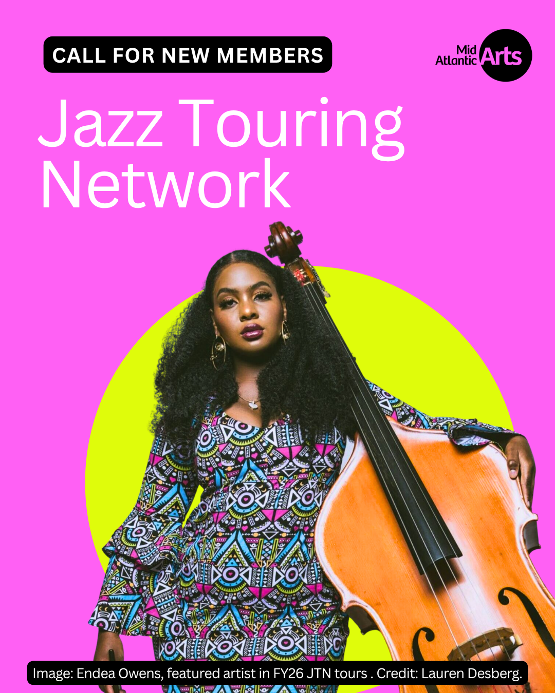 A woman in a multicolored dress holds a bass against a bright pink and green background