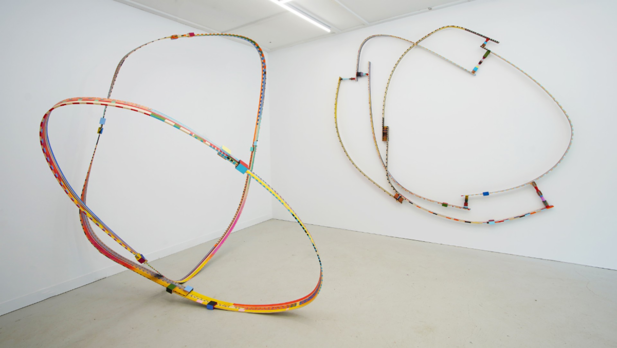 oblong sculptures in a white gallery room
