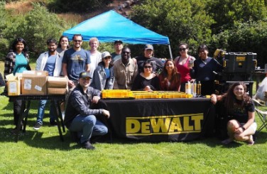 Two rows of SEAONC young members gather at a DeWalt table during a past summer picnic.