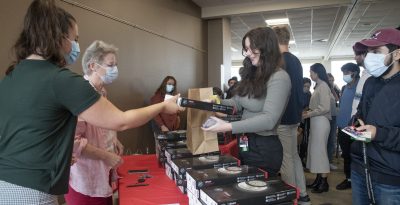 Student receives a box with their medical equipment in it.