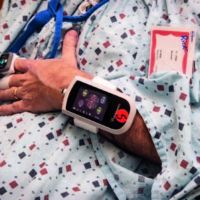 Arm wearing a heart monitoring device