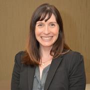 Brunette woman with bangs smiling