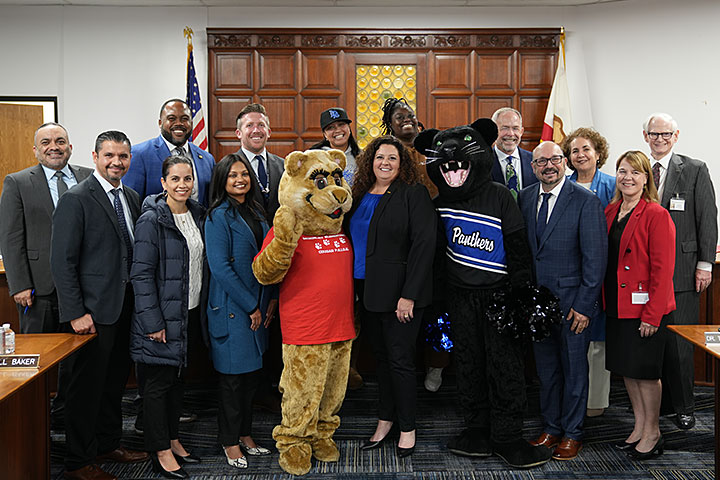 LBUSD leaders stand with Megan Kerr at the recent Board of Education Meeting
