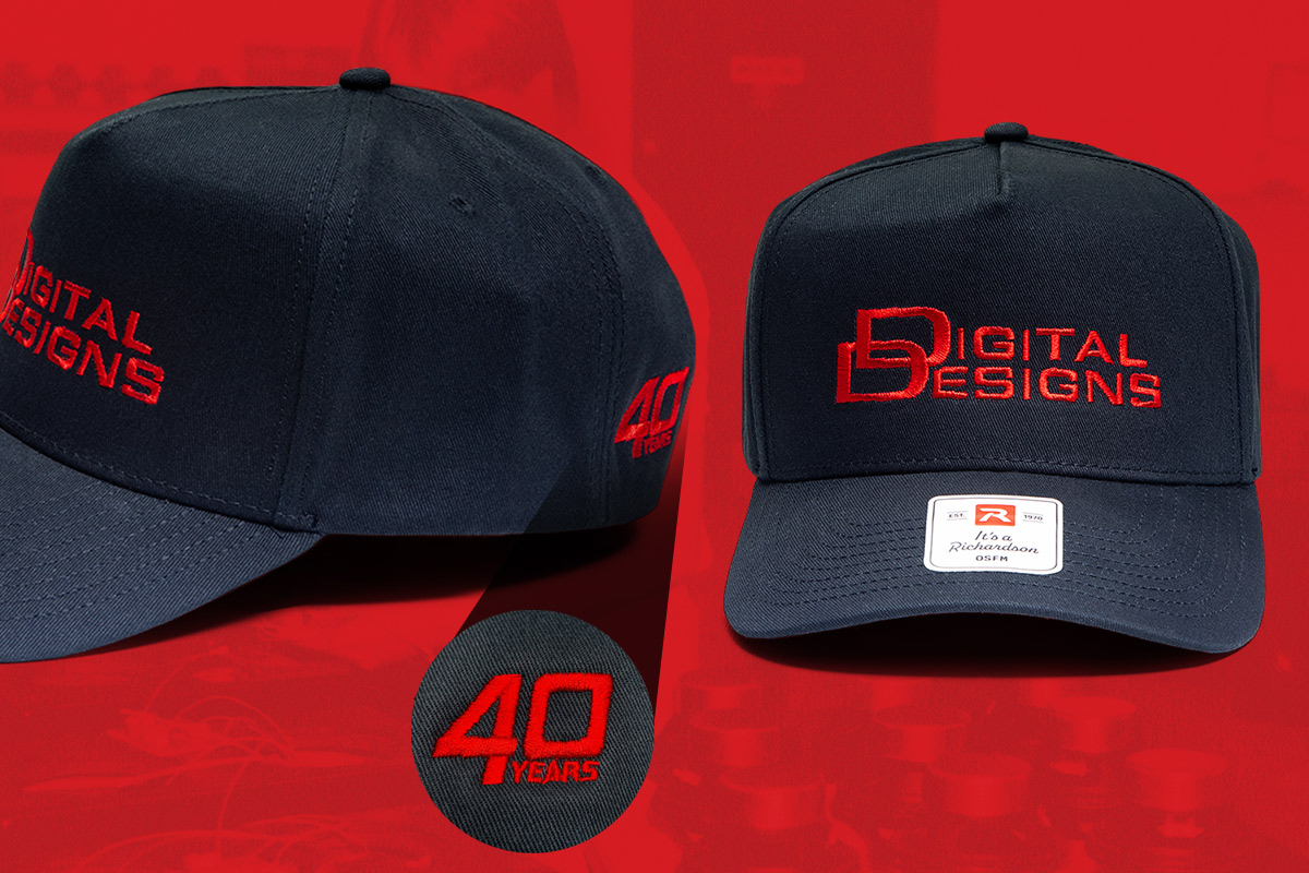 red background banner with Anniversary black hat with red embroidered digital designs logo on front 40th on back left and modern dd logo on back right snap back hat in two different views