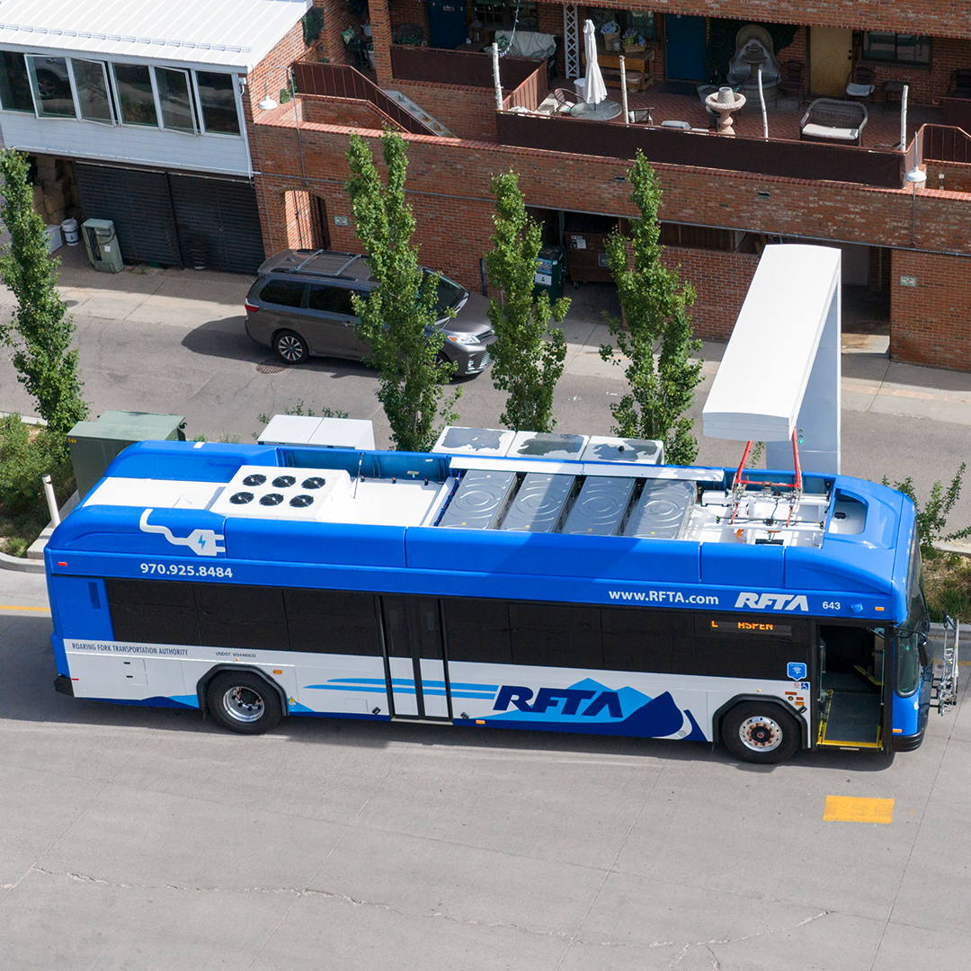 aerial view of a RFTA electric bus being charged at Rubey Park Transit Center