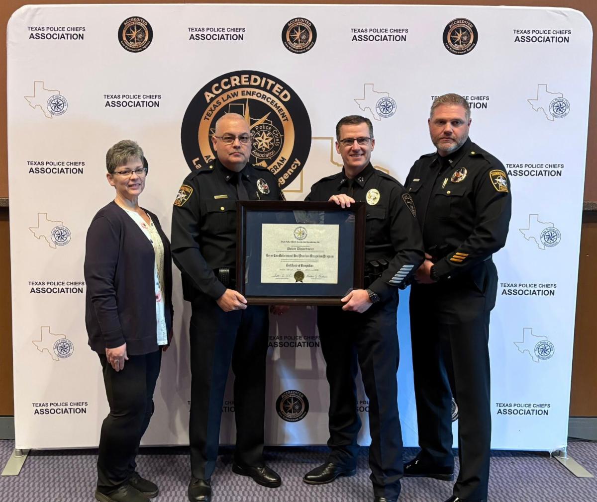 Photo of Sunnyvale Police senior staff receiving accreditation certificate